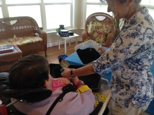 Laura working with a client using a modified trowel (with arm brace). It was a very rewarding activity for her as she only had the use of one arm/hand. It made her feel really productive and she wouldn't want to quit!